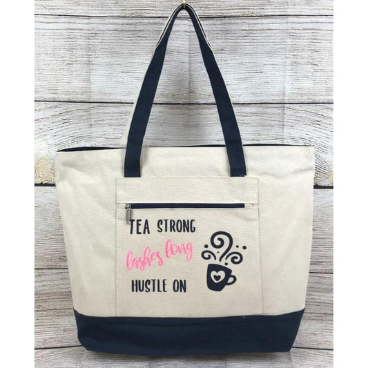 Canvas Tote with Front Zip Pocket "Tea Strong Lashes Long Hustle On"